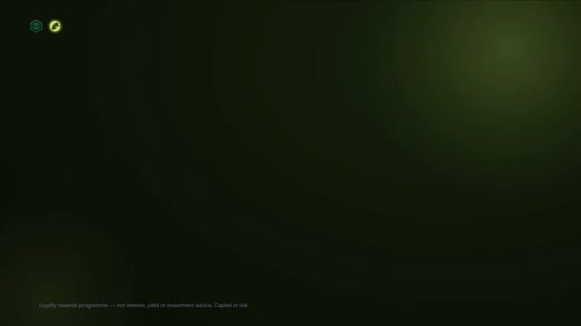 A nearly black screen with two small icons in the upper left and the text 'Loyalty rewards programme — not interest, yield or investment returns. Capital at risk.' at the bottom.