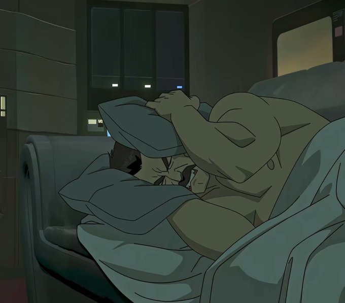An animated scene shows a character sleeping restlessly on a couch in a dimly lit room, clutching a pillow over their head.