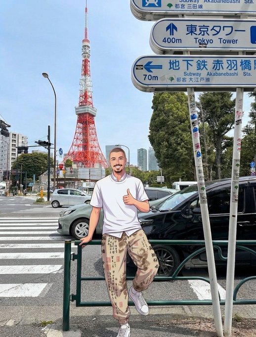 An illustrated man in a white t-shirt and patterned pants gives a thumbs-up beside a street sign in Tokyo, with "東京タワー (Tokyo Tower) 400m" and "地下鉄 赤羽橋 (Subway Akabanebashi Sta.) 70m" visible, and the iconic red and white Tokyo Tower standing prominently in the background.