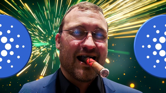 A man wearing glasses and a blue suit smokes a cigar, flanked by two blue Cardano (ADA) logos against a vibrant green and yellow fireworks background.