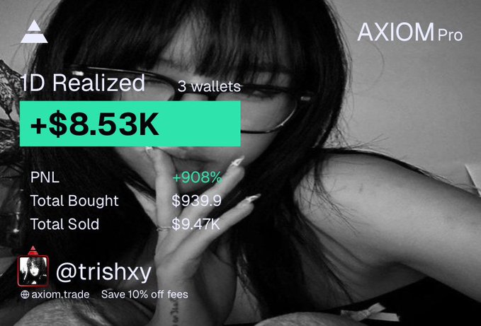 The image is a promotional graphic for AXIOM Pro showing trading results of +$8.53K realized across 3 wallets, with a PNL of +908%, total bought at $939.9, and total sold at $9.47K, credited to user @trishxy. It features a black-and-white photo of a woman with glasses and overlays promoting "Save 10% off fees" at axiom.trade, celebrating the trader's return to profitability as referenced in the post about "printing" again.