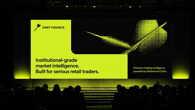 A presentation stage displaying a large screen for 'DART FINANCE' with the text 'Institutional-grade market intelligence. Built for serious retail traders.' and 'Precision trading intelligence powered by Robinhood Chain.'