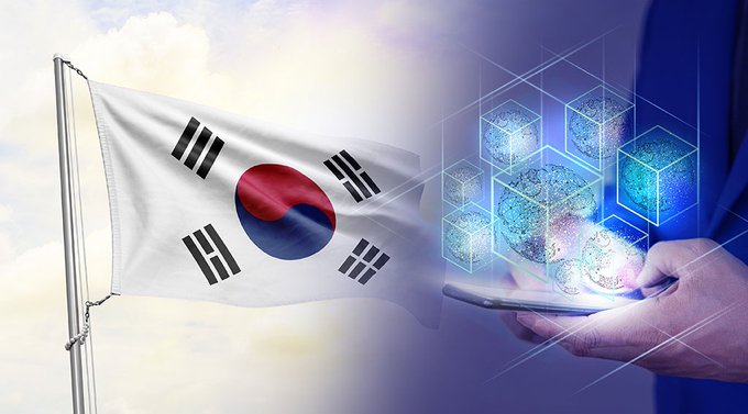 The South Korean flag waves beside a digital graphic depicting a blockchain network, illustrating the country's significant stablecoin outflows driven by demand for offshore digital assets. This imagery directly relates to the news of South Korean traders seeking access to derivatives, DeFi, and tokenized real-world assets on overseas platforms.