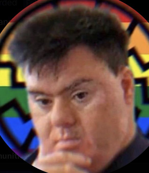 A circular cropped photo of a contemplative middle-aged man with brown hair, set against a blurred background featuring a colorful logo.