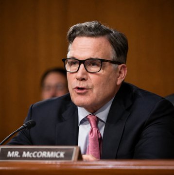 Senator Dave McCormick, identified by the "MR. McCORMICK" nameplate, speaks at a Senate hearing while warning against delaying the CLARITY Act, arguing that postponement would push U.S. crypto jobs, investment, and innovation overseas.