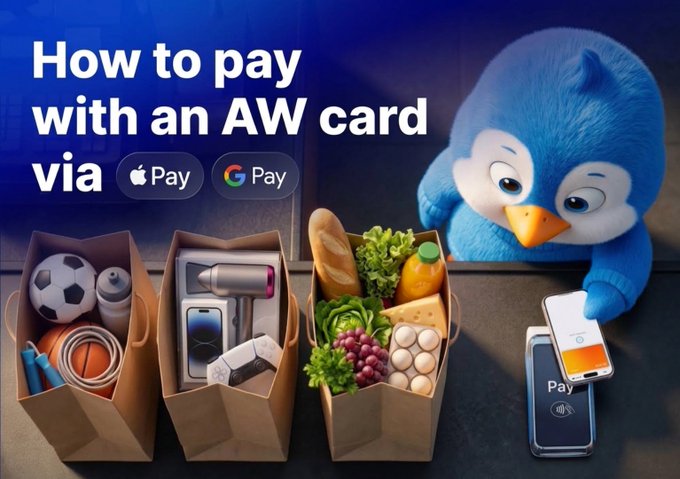 A promotional banner titled 'How to pay with an AW card via Apple Pay and Google Pay', showing shopping bags filled with goods and a blue penguin mascot holding a credit card over a payment terminal.