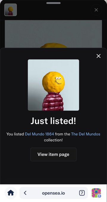 An OpenSea mobile app notification confirming 'Just listed!' for an item titled 'Del Mundo 1864 from the The Del Mundos collection,' featuring an image of a yellow smiley face ball wearing a small red puffer jacket.