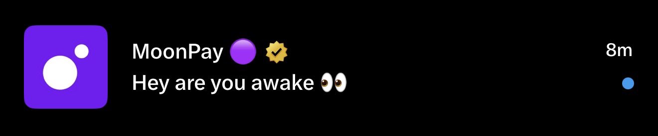 A screenshot of an Instagram-style direct message from MoonPay displaying the text "Hey are you awake 👀" alongside the brand's purple logo and a verified checkmark, timestamped 8 minutes ago.