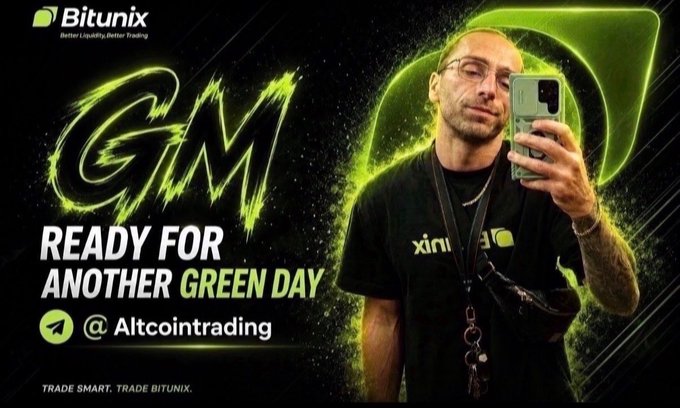 A promotional graphic for Bitunix cryptocurrency exchange featuring the text "GM - READY FOR ANOTHER GREEN DAY" alongside a man in a Bitunix t-shirt taking a selfie, tagged with "@Altcointrading" and "TRADE SMART. TRADE BITUNIX," aligning with the post's "GM Crypto" greeting and bullish trading sentiment.