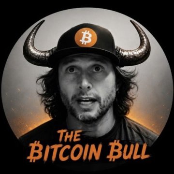 A stylized portrait illustration titled 'THE BITCOIN BULL' showing a man with long hair wearing a black cap with the Bitcoin '₿' symbol and large bull horns, with a glowing orange background.