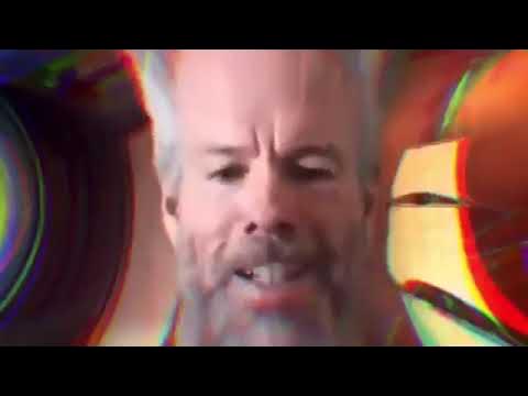The image features a man with a beard wearing glasses and a mustache, who appears to be talking or singing into a microphone. The background of the image has a colorful and abstract design that includes circles and lines, creating an artistic and visually appealing atmosphere. The caption below the image reads "buy puts, sell 32 coins, print, buy btc Arthur Hayes mode". This suggests that there might be some sort of advertisement or promotional material related to cryptocurrency or digital assets in the scene.