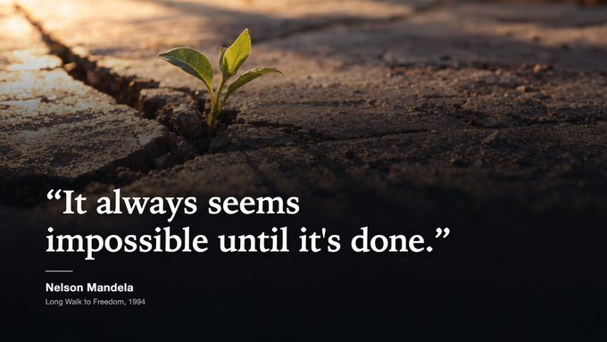 An inspirational quote graphic featuring 'It always seems impossible until it's done.' attributed to Nelson Mandela from 'Long Walk to Freedom, 1994', overlaid on an image of a small plant growing through a crack in stone.