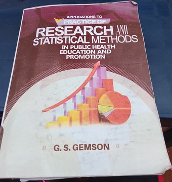 Textbook cover titled 'APPLICATIONS TO PRACTICE OF RESEARCH AND STATISTICAL METHODS IN PUBLIC HEALTH EDUCATION AND PROMOTION' by G.S. GEMSON, featuring bar chart and pie chart graphics.
