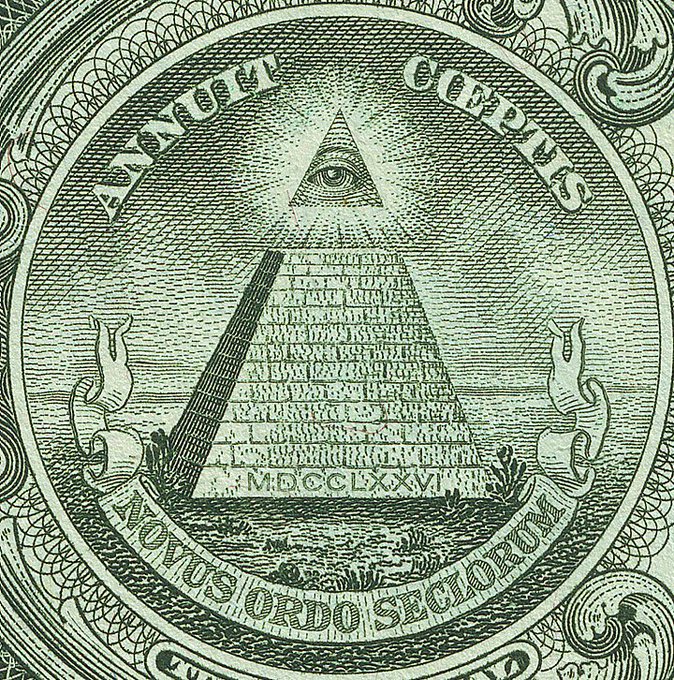 The reverse side of the US one dollar bill showing the 'all-seeing eye' pyramid with the Latin phrases 'ANNUIT COEPTIS' and 'NOVUS ORDO SECLORUM' along with the Roman numerals MDCCLXXVI.