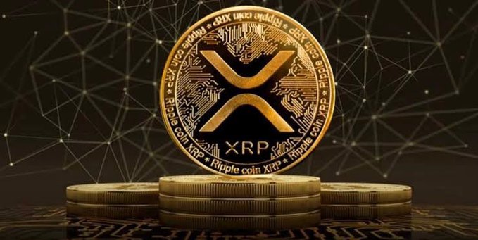 A large golden XRP cryptocurrency coin standing upright on a stack of smaller coins against a dark background with a glowing network pattern.
