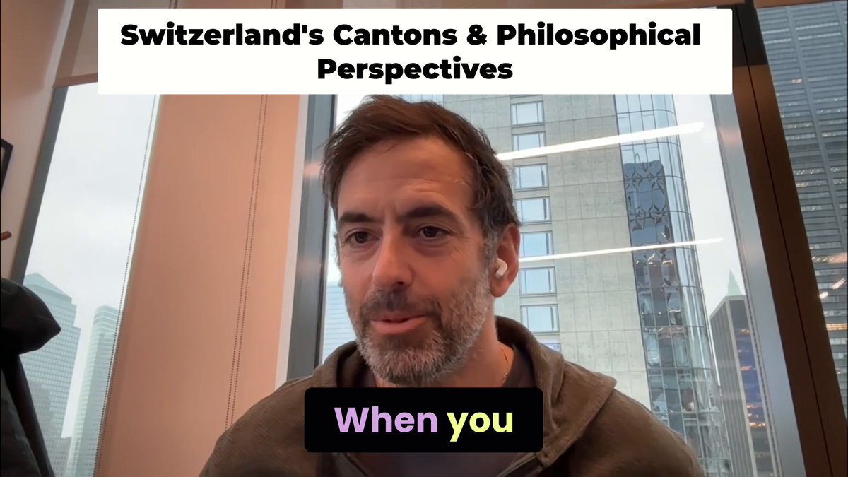 The image features a man wearing a brown jacket sitting at a desk or table near a window. The background of the image shows a cityscape with tall buildings, suggesting that they are located in Switzerland. The caption reads "When you take a train between cantons, you can't cross borders." This statement is related to the post about Switzerland's Canton and its Philosophical Perspectives.