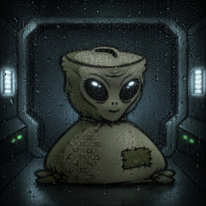 An illustration shows a stitched, plush-like alien figure with large glowing eyes sitting inside a dimly lit chamber, viewed through a rain-streaked window, with symbols on its body and a handprint patch on its shoulder.