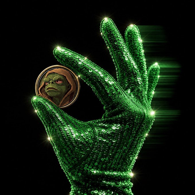 The image features a green glove with gold trim, which appears to be made of sequins or glittery material. A small green frog character is depicted inside the glove, giving the impression that the glove is being used as a wallet. The frog character seems to be walking into the glove from outside, creating an amusing and unexpected scene.