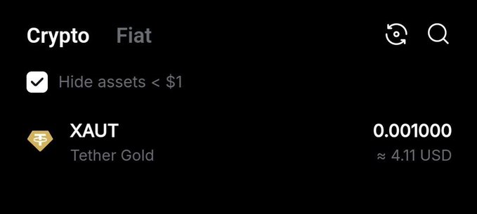 A screenshot of a crypto wallet interface showing 'XAUT Tether Gold' with a balance of 0.001000, approximately 4.11 USD.
