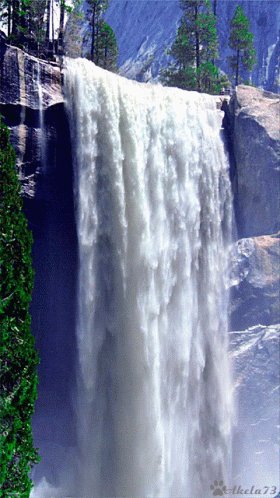 The image features a waterfall cascading down from a cliff, with water spraying out at various heights. The waterfall is surrounded by trees, creating a picturesque scene. The caption of the image includes some text that seems unrelated to the waterfall or the surrounding environment. It reads something like "$BTC $ETH $SOL Cascades are beautiful... unless they happen on your portfolio tracker...pucker up". This phrase does not seem to have any connection to the waterfall, but it is included in the caption for emphasis or humor.