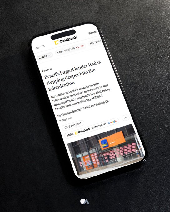 A smartphone displaying a CoinDesk article headlined 'Brazil's largest lender Itaú is stepping deeper into tokenization', with the CB20 ticker showing $1,721.59 and ETH at $562.8.