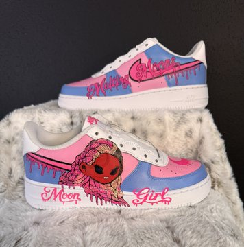 Custom pink and blue Nike sneakers designed by MeltingMoons and MeowMetaX, featuring dripping paint graphics and "Moon Girl" text, ready to be worn to NFT NYC.