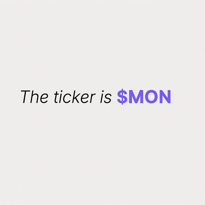 The image features a white background with black text that reads "The ticker is $MON". The text is written in a purple font style, which stands out against the white background. The caption below the image provides additional information about the content of the image.
