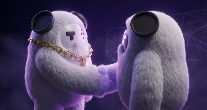 The image features two large, furry creatures shaking hands with each other against a purple background. The creatures are wearing chains around their necks, which adds a unique touch to the scene. The caption below the image reads "GM to everyone on X Been using Tria lately and ngl this is probably one of the smoothest crypto apps - swap - spend - bridge - move across chains". This suggests that the creatures might be discussing or negotiating something related to cryptocurrency, possibly sharing their experiences with it in a lighthearted manner.