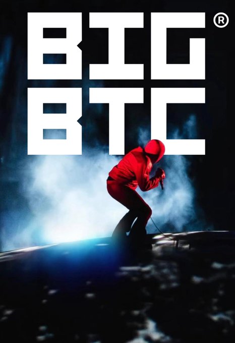 A stylized poster features the text 'BIG BTC' above a figure in a red jumpsuit and hood crouching in a dramatic pose amidst blue smoke and lighting.