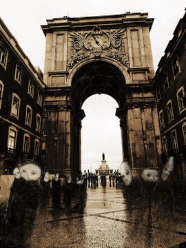 A sepia-toned photograph looking through a grand stone archway toward a column in the distance, with figures visible in the foreground.