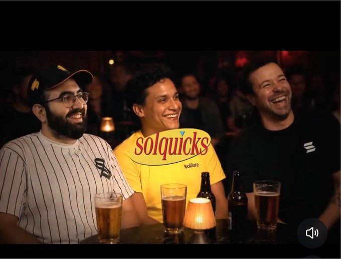 Three men laughing together at a bar, with beer glasses and a 'solquicks' logo with 'solflare' text overlaid on the center man's yellow shirt.