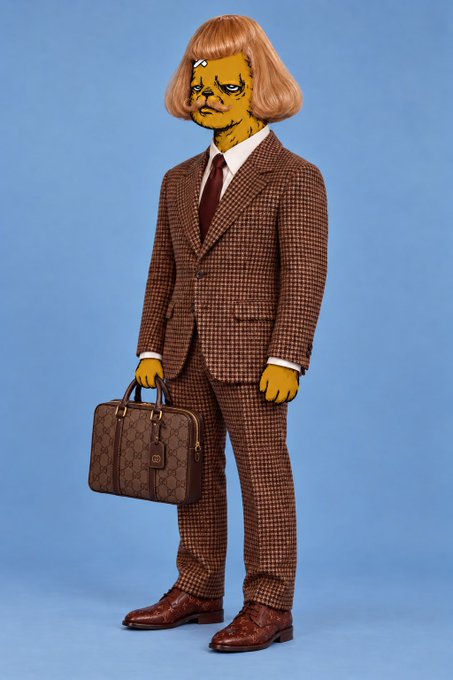 A figure stands against a blue background wearing a brown checkered suit, white shirt, and burgundy tie, while carrying a monogrammed briefcase. The figure has yellow skin, a distorted cartoonish face, and a brown bob haircut.