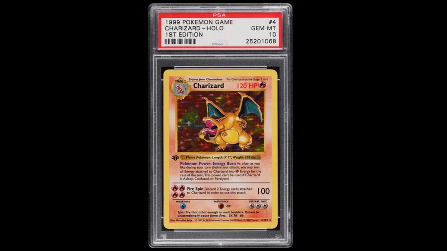 A PSA-graded GEM MT 10 1999 Pokémon Game 1st Edition holographic Charizard card (#4) in its protective holder, showing 120 HP and Pokémon Power 'Energy Burn'.