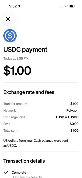 The image shows a phone screen displaying a transaction details page for a USDC payment app. The text on the screen reads "USDC Payment", indicating that the user has recently sent money through the app. The app's interface includes a list of fees, including exchange rate and total amount sent, as well as a summary of the transaction details.