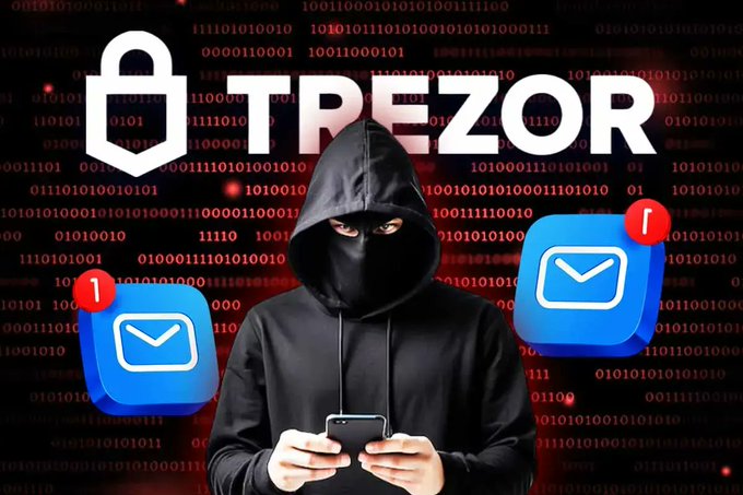 A hooded figure in black uses a smartphone against a backdrop of red binary code, with the "TREZOR" logo and shield icon above and email icons displaying notification badges on either side. The image visually represents the Trezor data breach affecting 13,689 users, symbolizing the exposure of customer contact information (emails) through a compromised shipping provider, while emphasizing that the hardware wallets themselves remain secure.