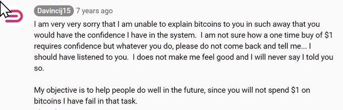 A user named "Davincij15" posted a comment 7 years ago expressing regret for failing to convince someone to buy $1 worth of bitcoin, believing he failed his mission to help people succeed in the future. The post references this old comment alongside a "#bitcoin" shirt, highlighting how the missed $1 bitcoin investment has aged dramatically over 15 years.