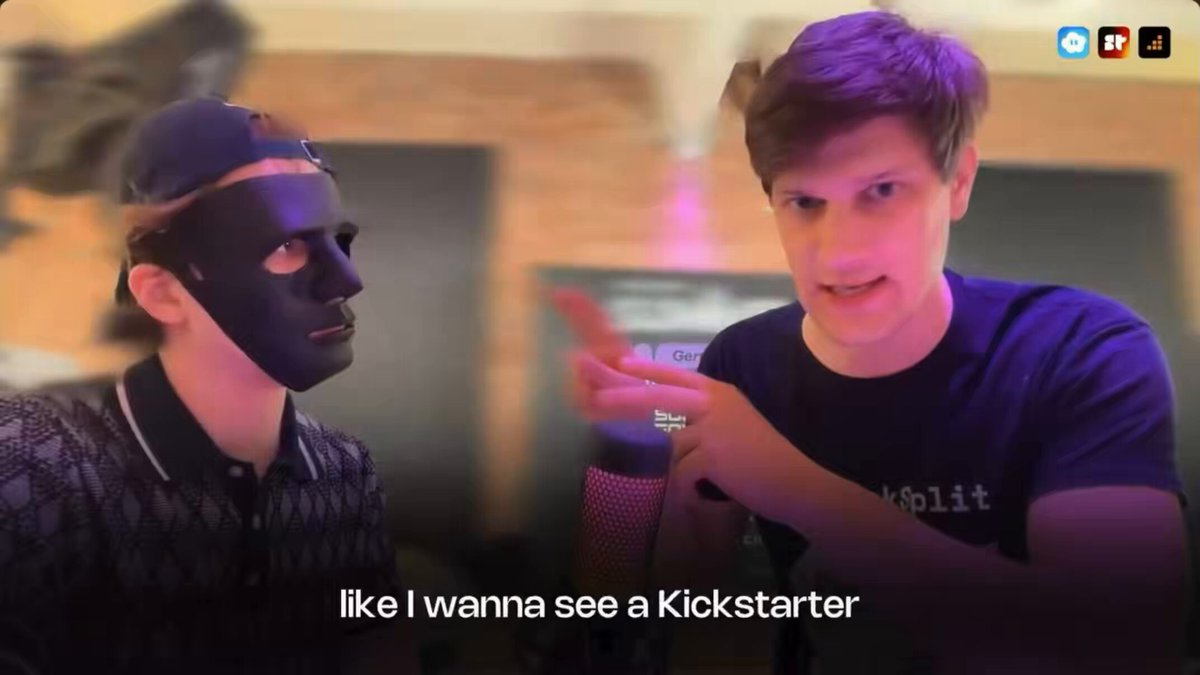 The image shows two men wearing masks, with one man pointing at a microphone while the other looks confused or intrigued by his actions. The caption of the image reads "like I want to build the next billion dollar startup on solana but don't know what to build? here's an idea from @JosipVolarevic2 @MetaDAOProject for creative projects who's gonna make this?".