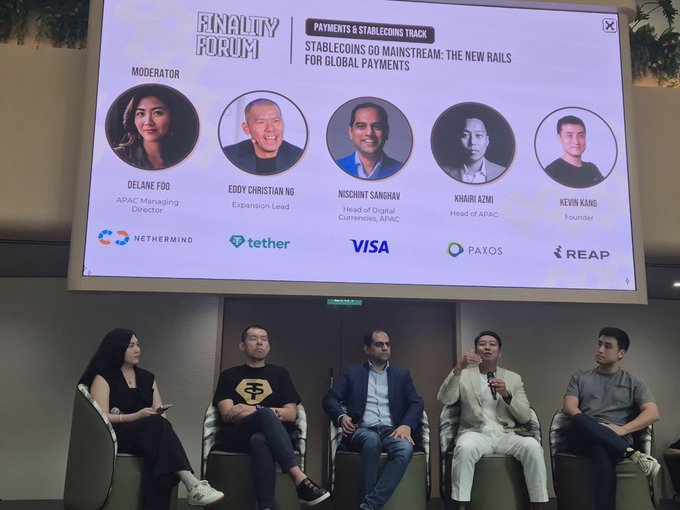 A panel discussion at the 'Finality Forum' titled 'Stablecoins Go Mainstream: The New Rails for Global Payments,' featuring moderator Delane Foo and speakers Eddy Christian Ng, Nishchint Sanghavi (Head of Digital Currencies, APAC), Khabil Azmi (Head of APAC, Visa), and Kevin Kang (Founder, Reap), with logos for Nethermind, Tether, Visa, Paxos, and Reap displayed.
