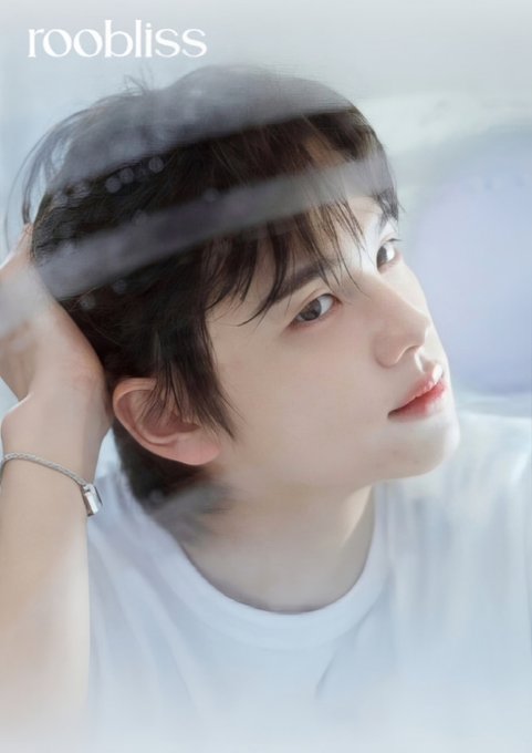A young man with dark hair gazes thoughtfully to the side while wearing a white shirt and a silver bracelet, with "roobliss" displayed in the upper left corner, fitting the post's reference to "#ShinYu #SHINYU Rubyless."