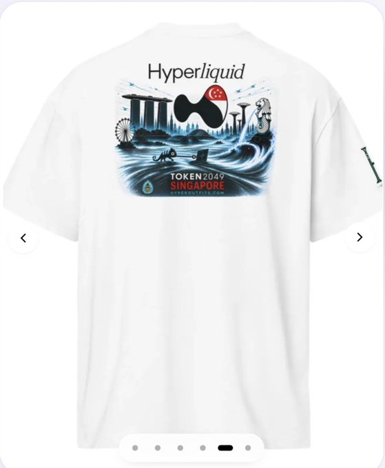 A white t-shirt featuring a graphic design that includes the text 'Hyperliquid', 'TOKEN2049 SINGAPORE', and an illustration incorporating Singapore landmarks like Merlion and Marina Bay Sands.