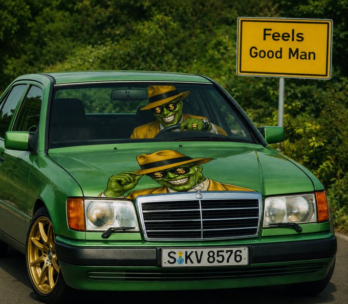The image features a green Mercedes-Benz car with a sticker of two men wearing suits, one with a mask over their face, sitting behind the wheel. There are also two people standing next to the car, possibly admiring its design or discussing the sticker on the hood. The background includes trees and bushes, adding to the overall aesthetic appeal of the scene. The post that reads "Just $MASK" is likely related to a recent purchase by the owner of the car, as it features an image of their Mercedes-Benz vehicle with a sticker on its hood.