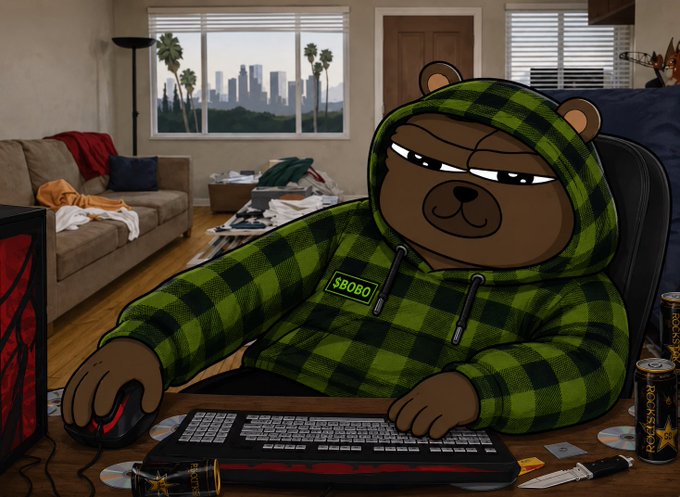 An illustration shows a cartoon bear wearing a green plaid hoodie with 'SBOBO' on the chest, sitting at a desk in a messy room with a keyboard, mouse, Rockstar and what looks like an energy drink, with a city view through the window.