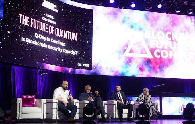 A panel discussion at the Blockchain Futurist Conference with on-screen text reading 'THE FUTURE OF QUANTUM', 'Q-Day is Coming: Is Blockchain Security Ready?', and 'CMC SPONSORS'.