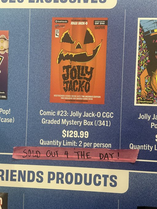 A display board advertises 'Comic #23: Jolly Jack-0 CGC Graded Mystery Box (/341)' for $129.99, with a handwritten red note stating 'SOLD OUT 4 THE DAY!' across it.