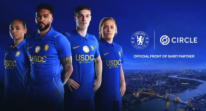 Four Chelsea FC players model blue away jerseys featuring 'USDC by CIRCLE' branding, promoting Circle as the club's 'OFFICIAL FRONT OF SHIRT PARTNER' against a London cityscape.