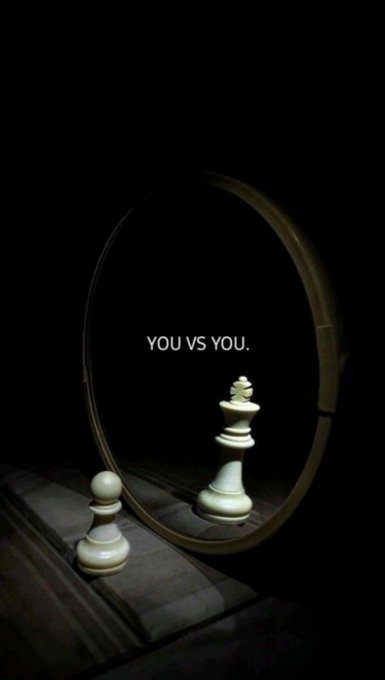 A pawn chess piece looks at its reflection in a mirror with the text "YOU VS YOU."