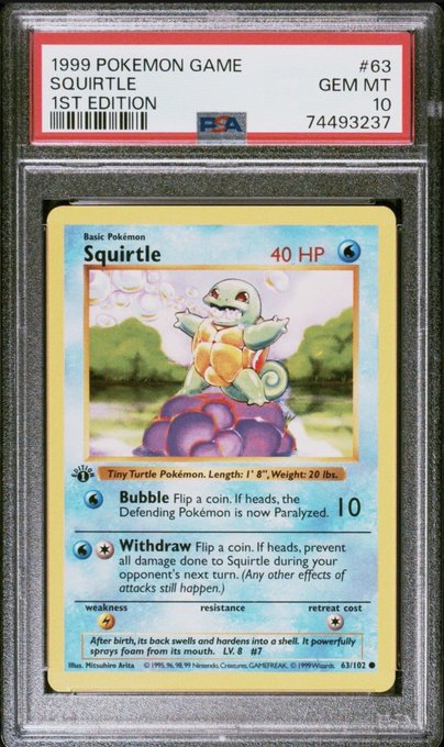 A PSA Gem Mint 10 graded 1999 Pokémon Game 1st Edition Squirtle card (#63) sits encapsulated in its slab. In contrast to the bold $20 million Bitcoin prediction, this card represents a more tangible collectible—Squirtle, the Tiny Turtle Pokémon with 40 HP and attacks "Bubble" and "Withdraw," graded as nearly flawless and bearing certification number 74493237.