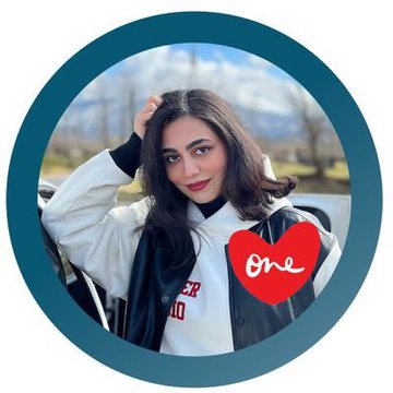 A young woman with long dark hair poses outdoors, with a red heart graphic reading "One" overlaid on the image. The post identifies her as @tara__art, today's curator for AEW's #AEW community initiative to reinvest 15% of sales into purchasing members' pieces on Tezos.