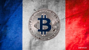 The image features a flag with the word "bitcoin" written on it, which is the main focus of the picture. The flag has blue, white, and red colors, creating an interesting contrast against each other. The background of the image is a dark gray color that makes the vibrant colors of the flag stand out even more.