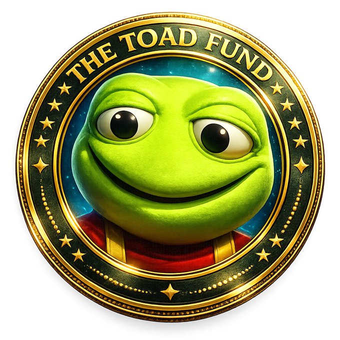 A coin-style logo featuring a 3D-rendered green Pepe-style toad face with large eyes and a smug smile, encircled by a gold border with stars and the text "THE TOAD FUND".